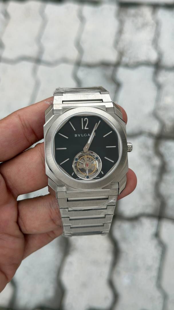 bvlgarr i   Octo Finissimo watch features a distinctive tourbillon complication visible at the 6 oclock position.   automatic back opne  most premium stainless steel