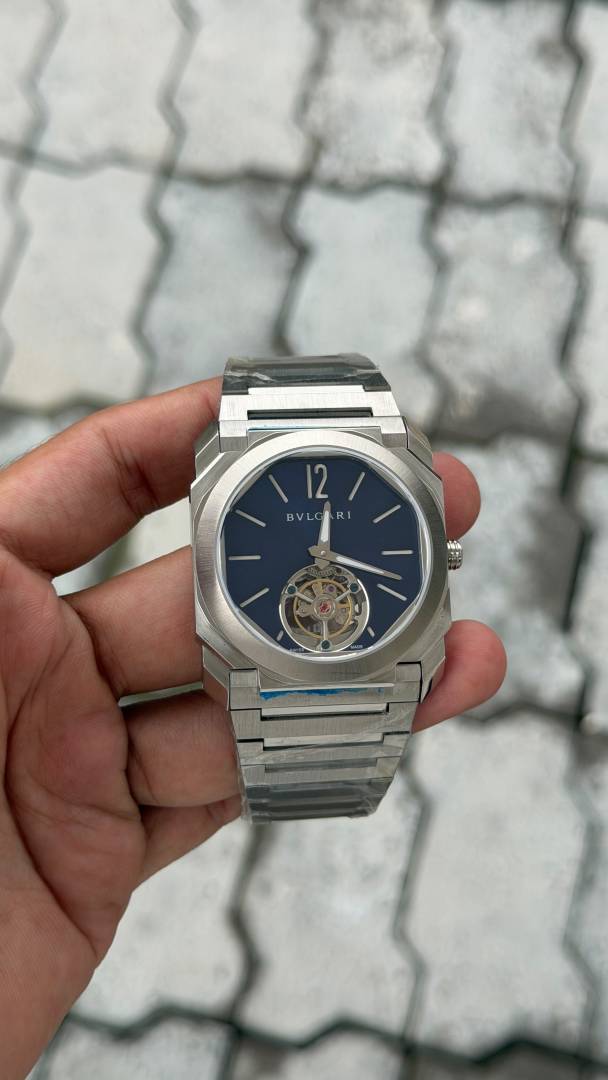 bvlgarr i   Octo Finissimo watch features a distinctive tourbillon complication visible at the 6 oclock position.   automatic back opne  most premium stainless steel