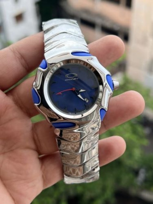 OAKLEY SILVER BLUE METAL BODY