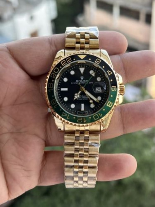 ROLEX GMT MASTER 2 GOLD GREEN