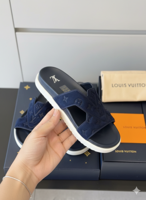 LouisVuitton Monogram Suede Riviera Flat Mules in Navy Blue.