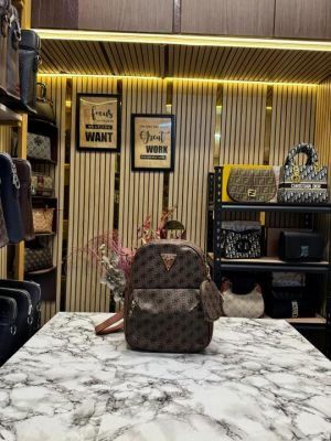 GUESS WOMENS BRAND LOGO BAGPACK WITH DUST BAG AND POUCH (DARK BROWN)