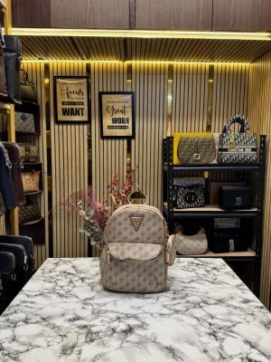 GUESS WOMENS BRAND LOGO BAGPACK WITH DUST BAG AND POUCH (LIGHT BROWN)