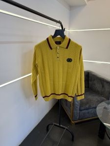 Gucc i knitted imported sweatshirt with brand button and logo on chest yellow gold