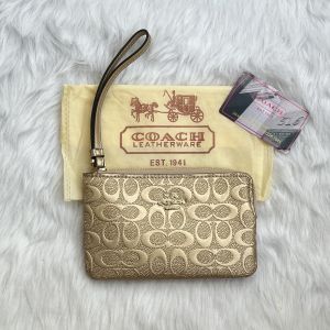 Coach_Golden_Emboss_Wristlet_With_DustCover