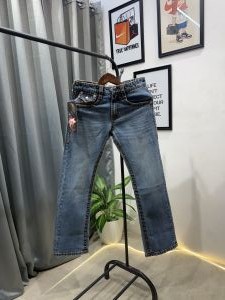 True religion boot cut blue imported denim with brand buttons