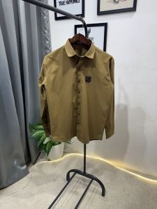 Hugoboss tukey imported shirt with brand button and logo on chest musturd