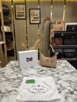 PRAD_A RE EDITION GLOSSY BAG WITH OG BOX DUST BAG CARD CREAM