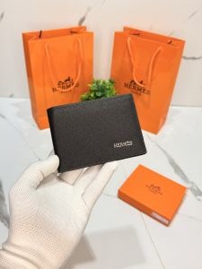 Herme_s black textured leather Riviera bi-fold wallet HM-052 with og box card and carry bag