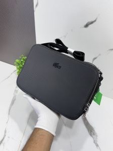 Lacost_e 2007 black textured side bag with black brand logo