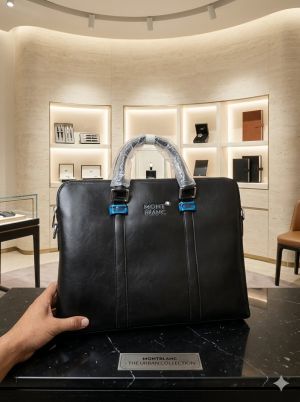 M_ontblanc_ Laptop bag from the Urban Collection is crafted from black leather and features the brands signature emblem on the front with Dust Cover premium quality