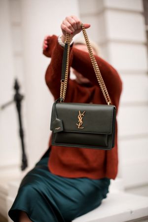 Saintt_Laurent_ bag features a prominent gold-tone YSL plaque and is packaged in its original box premium quality