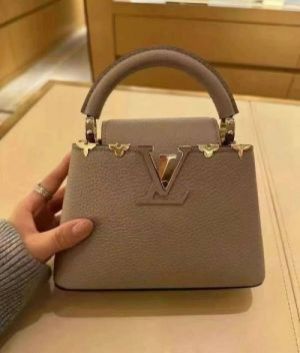 Louuis_Vuitton Capucines BB handbag featuring unique gold-toned floral hardware along the top edge With Double Box